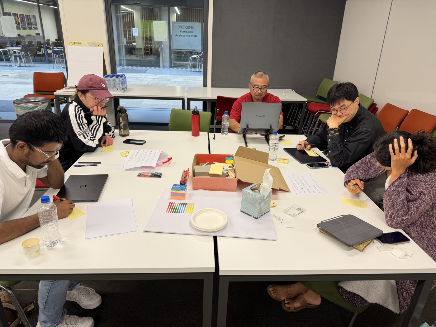 Workshop participants working through design concepts at the table